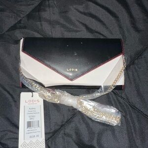 Lodis Black and White Wristlet Clutch Versatile Design
